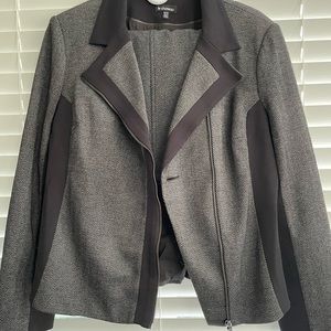 Jacket and skirt suit. Grey chevron with black trim.